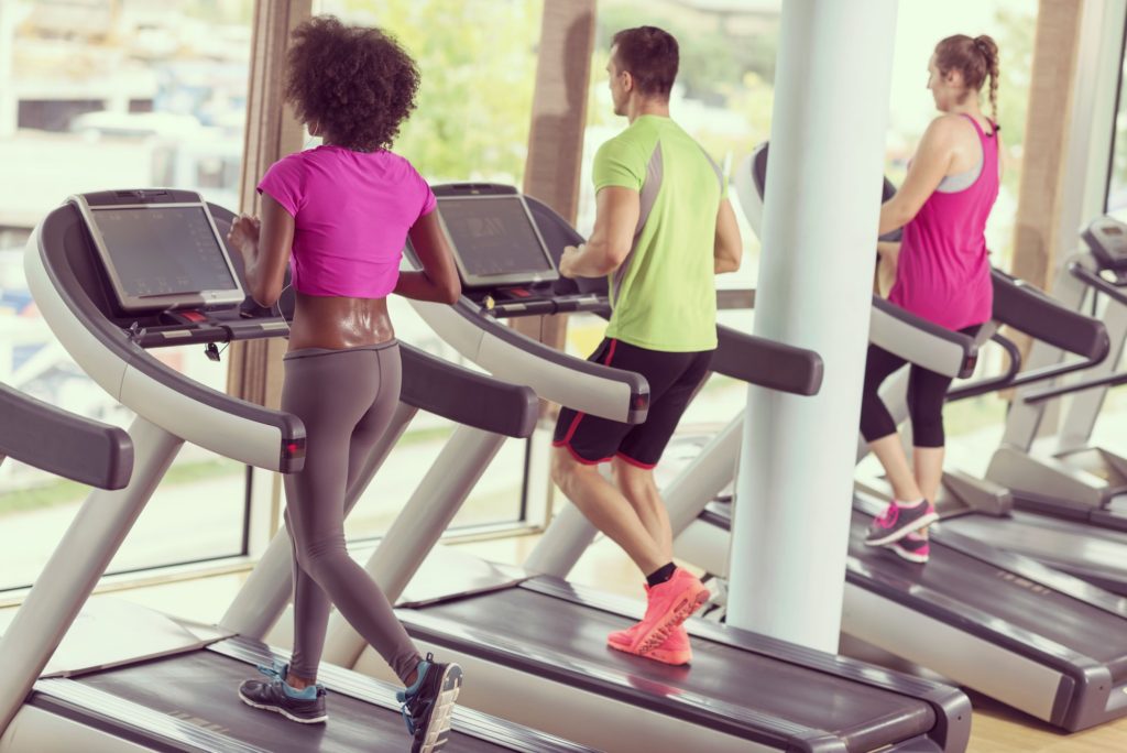 people exercisinng a cardio on treadmill