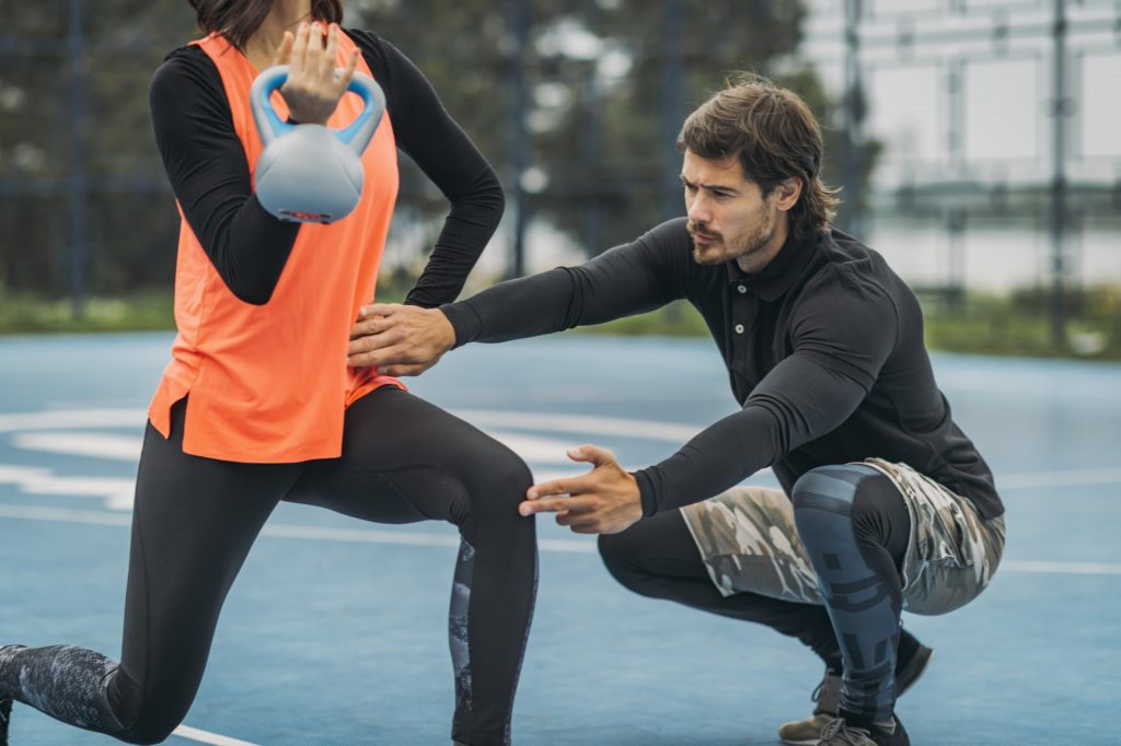 Kettlebell Strength Training with Personal Trainer Outdoors